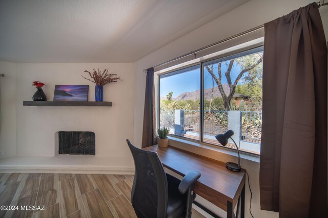 5617 N Camino Del Conde, Tucson, AZ 85718 - office with a fireplace with raised hearth and a mountain view