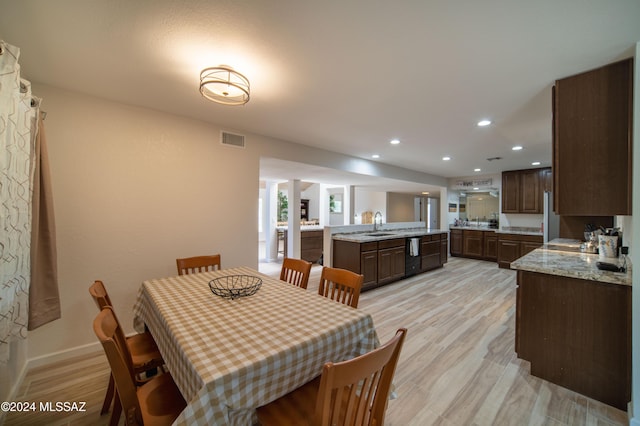 5617 N Camino Del Conde, Tucson, AZ 85718 - dining space featuring recessed lighting, light wood-style flooring, and baseboards