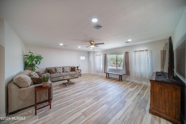 5617 N Camino Del Conde, Tucson, AZ 85718 - living area featuring ceiling fan, recessed lighting, light wood-type flooring, and baseboards