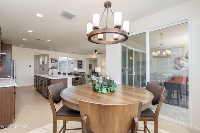 7823 W Buckeye Path, Marana, AZ 85658 - dining room featuring a chandelier, recessed lighting, ceiling fan, baseboards, and light tile patterned flooring