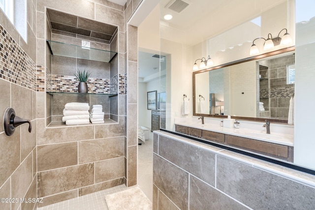 7823 W Buckeye Path, Marana, AZ 85658 - bathroom featuring double vanity and a walk in shower