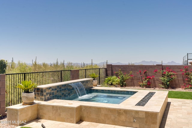7823 W Buckeye Path, Marana, AZ 85658 - view of swimming pool featuring an in-ground hot tub, a fenced backyard, and a mountain view