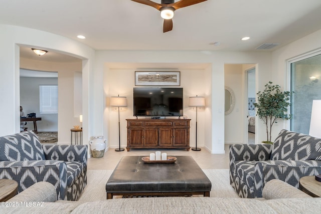 7823 W Buckeye Path, Marana, AZ 85658 - living room with light tile patterned flooring, ceiling fan, baseboards, and recessed lighting