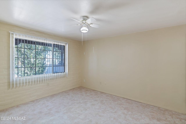 341 W Camino Penasco Apt B, Green Valley, AZ 85614 - spare room featuring a ceiling fan and baseboards