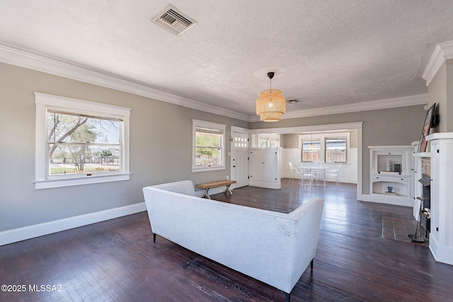 1034 N 7th Ave, Tucson, AZ 85705 - living area with a textured ceiling, baseboards, dark wood-style floors, and crown molding