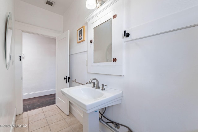 1034 N 7th Ave, Tucson, AZ 85705 - bathroom featuring tile patterned floors and baseboards
