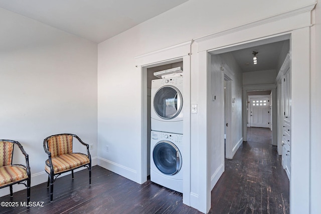1034 N 7th Ave, Tucson, AZ 85705 - laundry area featuring stacked washer / dryer, baseboards, and hardwood / wood-style flooring