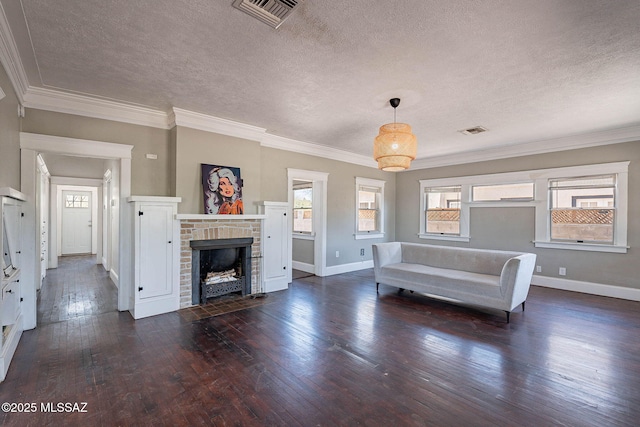 1034 N 7th Ave, Tucson, AZ 85705 - living room with a textured ceiling, dark wood-style flooring, baseboards, a brick fireplace, and crown molding
