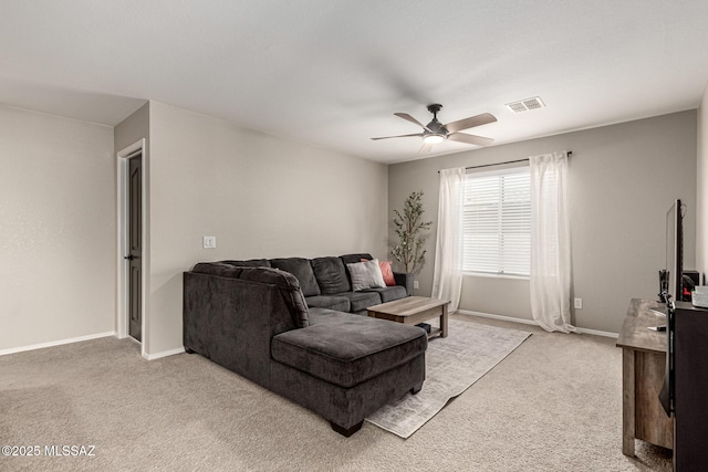 1257 W Calle Libro Del Retrato, Sahuarita, AZ 85629 - living area with light colored carpet, ceiling fan, and baseboards