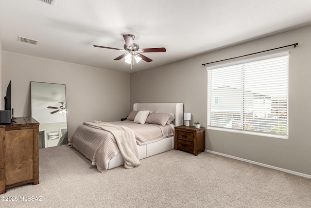 1257 W Calle Libro Del Retrato, Sahuarita, AZ 85629 - bedroom featuring light carpet, baseboards, and a ceiling fan