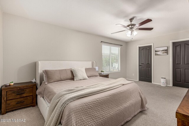 1257 W Calle Libro Del Retrato, Sahuarita, AZ 85629 - bedroom with baseboards, carpet flooring, and a ceiling fan