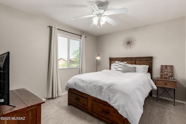 1257 W Calle Libro Del Retrato, Sahuarita, AZ 85629 - bedroom featuring light carpet, baseboards, and ceiling fan