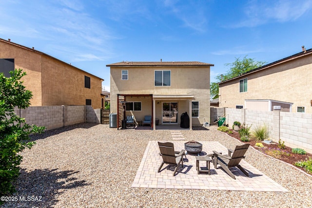 1257 W Calle Libro Del Retrato, Sahuarita, AZ 85629 - back of property with a fire pit, a patio, stucco siding, a fenced backyard, and central air condition unit