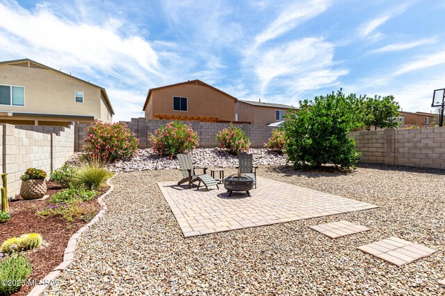 1257 W Calle Libro Del Retrato, Sahuarita, AZ 85629 - fenced backyard featuring an outdoor fire pit and a patio