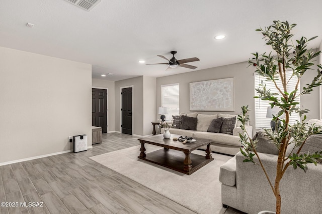 1257 W Calle Libro Del Retrato, Sahuarita, AZ 85629 - living area featuring ceiling fan, recessed lighting, baseboards, and light wood-type flooring