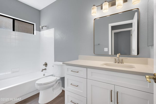 4996 N Valle Rd, Tucson, AZ 85750 - bathroom featuring toilet, vanity, wood finished floors, and shower / washtub combination