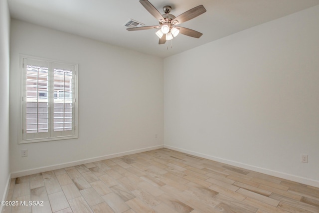 9016 W Birchover Dr, Marana, AZ 85653 - spare room with ceiling fan, light wood-type flooring, and baseboards