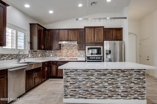 9016 W Birchover Dr, Marana, AZ 85653 - kitchen featuring appliances with stainless steel finishes, a sink, a center island, recessed lighting, and under cabinet range hood