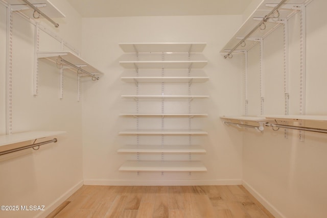 9016 W Birchover Dr, Marana, AZ 85653 - spacious closet featuring light wood-style flooring