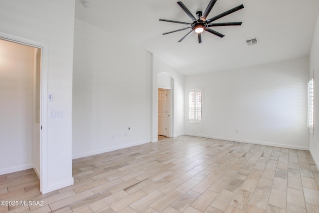 9016 W Birchover Dr, Marana, AZ 85653 - unfurnished room with ceiling fan, vaulted ceiling, light wood finished floors, baseboards, and arched walkways