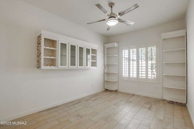 9016 W Birchover Dr, Marana, AZ 85653 - spare room with ceiling fan, baseboards, and light wood-type flooring