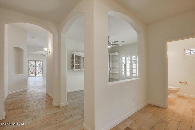 9016 W Birchover Dr, Marana, AZ 85653 - corridor with healthy amount of natural light, light wood-style floors, and baseboards