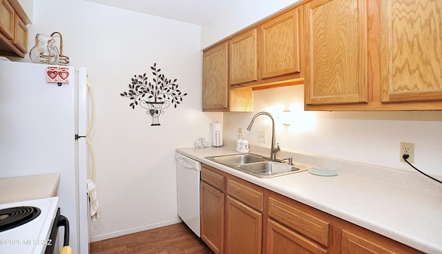 441 W Yucca Ct Unit 209, Tucson, AZ 85704 - kitchen with white appliances, a sink, wood finished floors, light countertops, and baseboards
