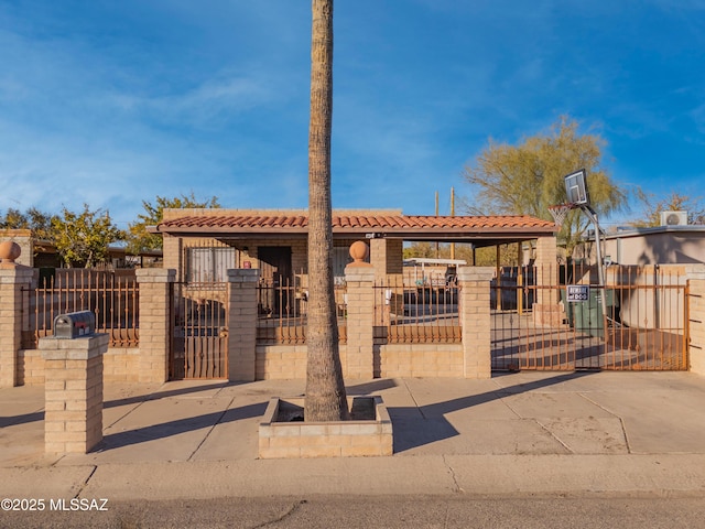 1410 W Sonora St, Tucson, AZ 85745 - view of front facade with a tile roof, a gate, and a fenced front yard