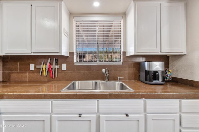 1410 W Sonora St, Tucson, AZ 85745 - kitchen featuring a sink, white cabinets, and recessed lighting