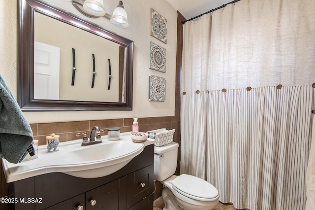 1410 W Sonora St, Tucson, AZ 85745 - bathroom featuring vanity, toilet, and tile walls