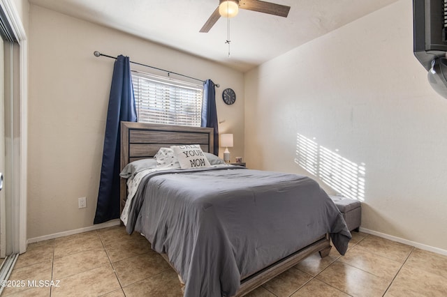 1410 W Sonora St, Tucson, AZ 85745 - bedroom with light tile patterned floors, baseboards, and a ceiling fan