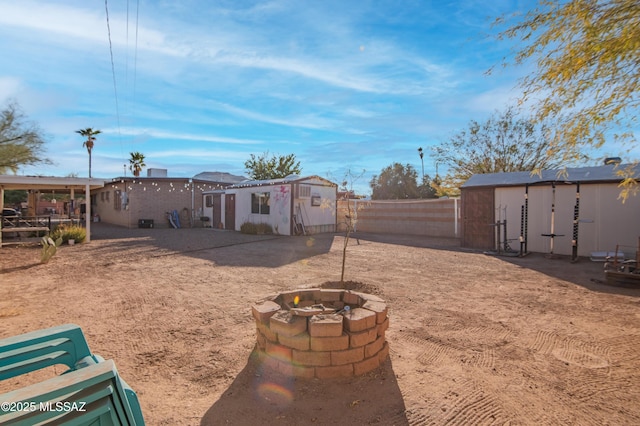1410 W Sonora St, Tucson, AZ 85745 - fenced backyard with an outdoor fire pit