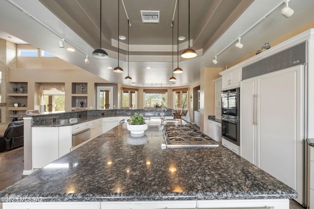 4141 W Camino Del Norte, Tucson, AZ 85742 - kitchen featuring stainless steel appliances, a large island with sink, open floor plan, white cabinets, and dark stone counters