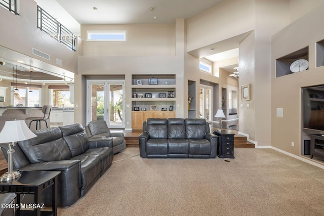 4141 W Camino Del Norte, Tucson, AZ 85742 - living area with a high ceiling, carpet, and baseboards
