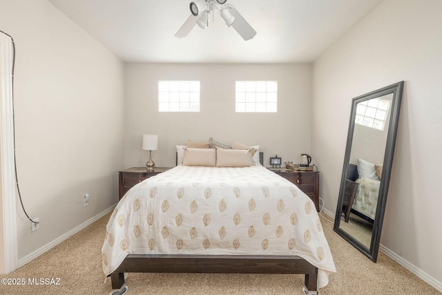 4141 W Camino Del Norte, Tucson, AZ 85742 - bedroom featuring light carpet, baseboards, and a ceiling fan