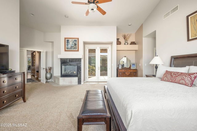 4141 W Camino Del Norte, Tucson, AZ 85742 - carpeted bedroom with lofted ceiling, a fireplace, access to exterior, and ceiling fan