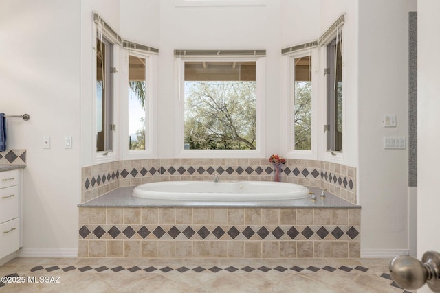 4141 W Camino Del Norte, Tucson, AZ 85742 - bathroom featuring tile patterned flooring, a garden tub, and baseboards