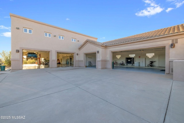 4141 W Camino Del Norte, Tucson, AZ 85742 - back of property with driveway, a tiled roof, and stucco siding