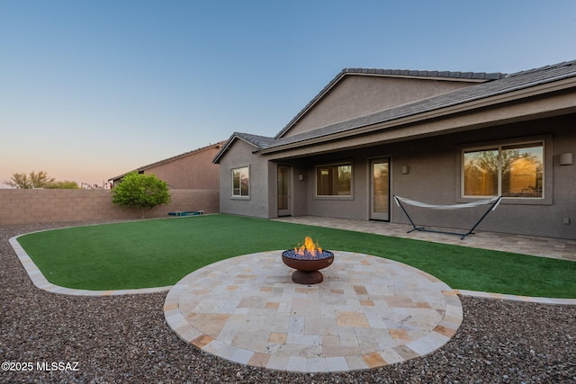 12584 N Sunrise Shadow Dr, Marana, AZ 85658 - back of house with stucco siding, a patio, and a fire pit