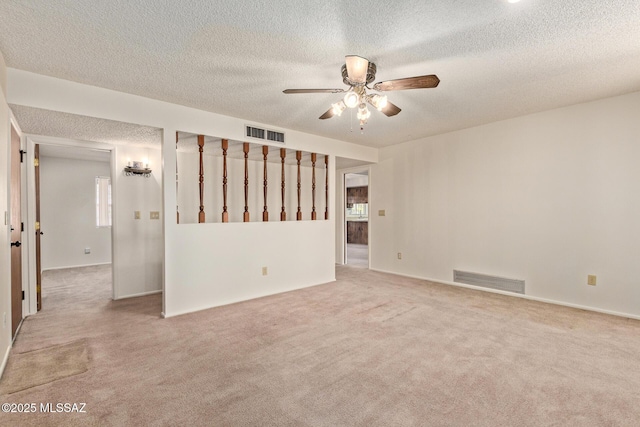 555 E Rudasill Rd, Tucson, AZ 85704 - spare room with carpet floors, a ceiling fan, a textured ceiling, and baseboards