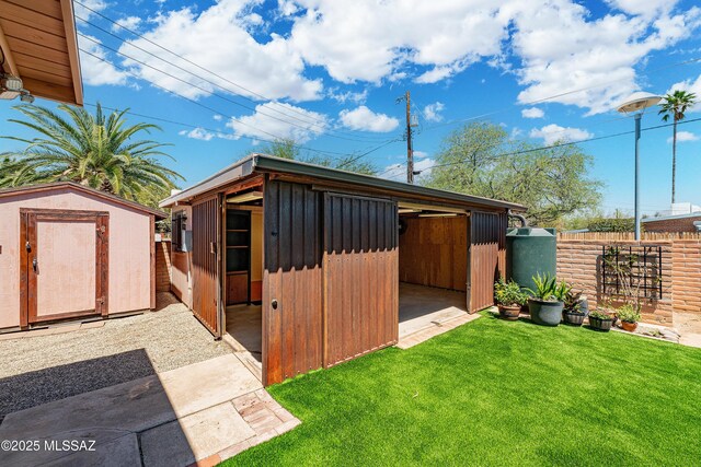 3225 E Elida St, Tucson, AZ 85716 - back of property with a gate and brick siding