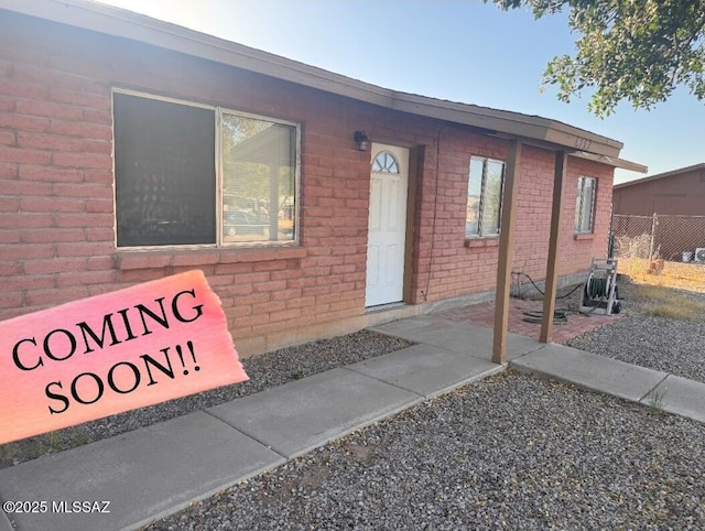 6732 S Draper Rd, Tucson, AZ 85757 - doorway to property featuring brick siding