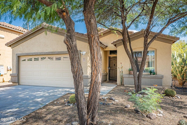 493 W Corte Planga, Sahuarita, AZ 85629 - view of front facade featuring a garage, driveway, and stucco siding