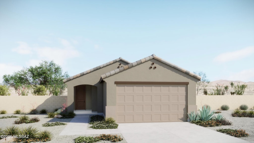 5947 E Jayden Ln, Tucson, AZ 85756 - mediterranean / spanish-style home with a garage, concrete driveway, and stucco siding