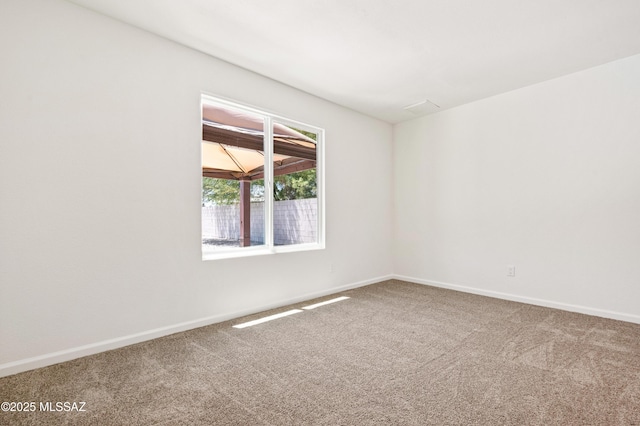 7112 S Haskins Dr, Tucson, AZ 85746 - spare room with carpet flooring and baseboards