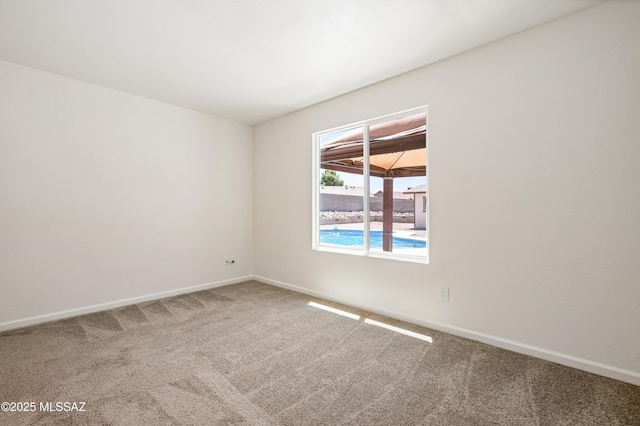 7112 S Haskins Dr, Tucson, AZ 85746 - carpeted spare room with baseboards