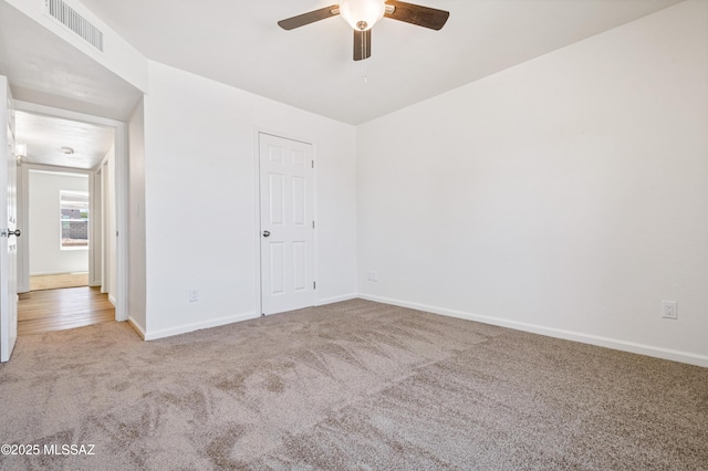 7112 S Haskins Dr, Tucson, AZ 85746 - unfurnished room with carpet flooring, a ceiling fan, and baseboards