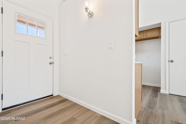 7112 S Haskins Dr, Tucson, AZ 85746 - foyer featuring light wood finished floors and baseboards