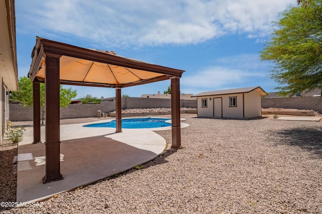 7112 S Haskins Dr, Tucson, AZ 85746 - view of pool with a gazebo, a patio, an outbuilding, and a fenced backyard