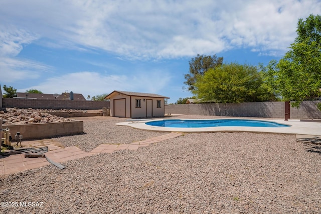 7112 S Haskins Dr, Tucson, AZ 85746 - view of swimming pool featuring an outbuilding, a fenced backyard, and a patio area